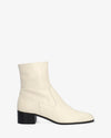 Heeled booties in off-white leather