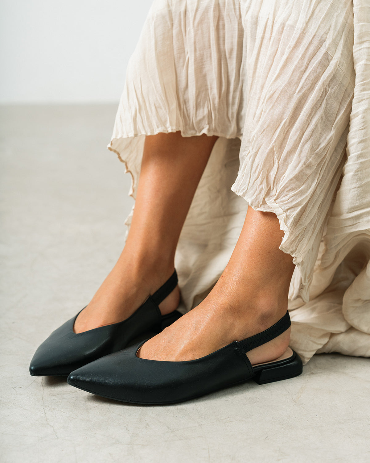 Black leather slingback flat