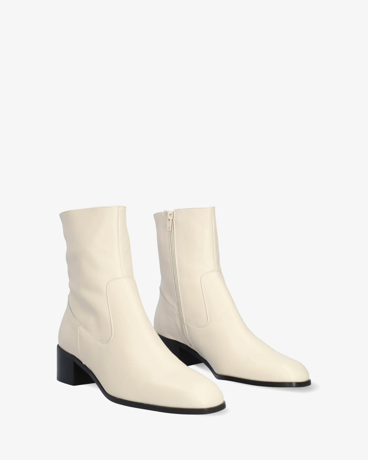 Heeled booties in off-white leather