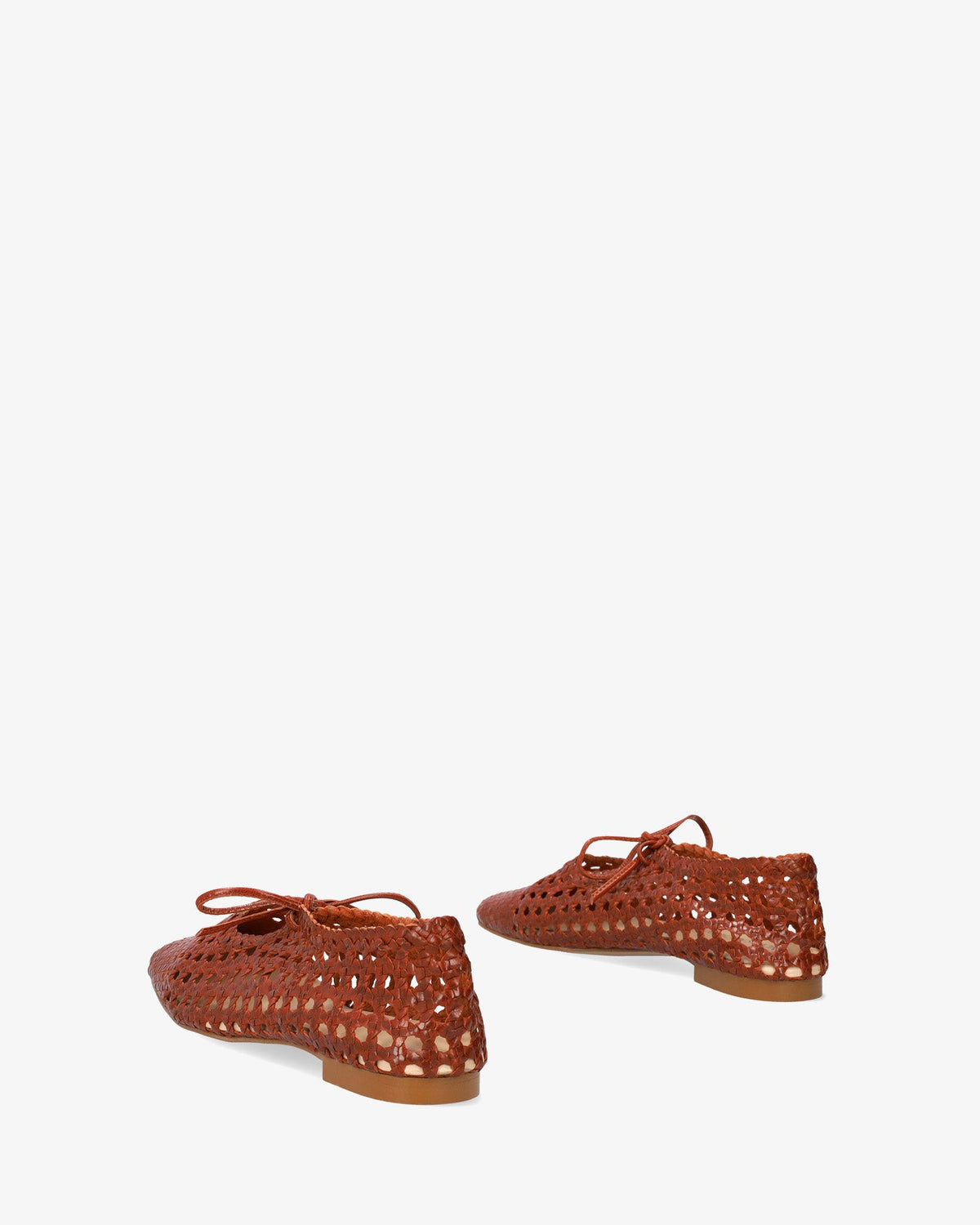 Flat shoes with a terracotta-colored mesh pattern