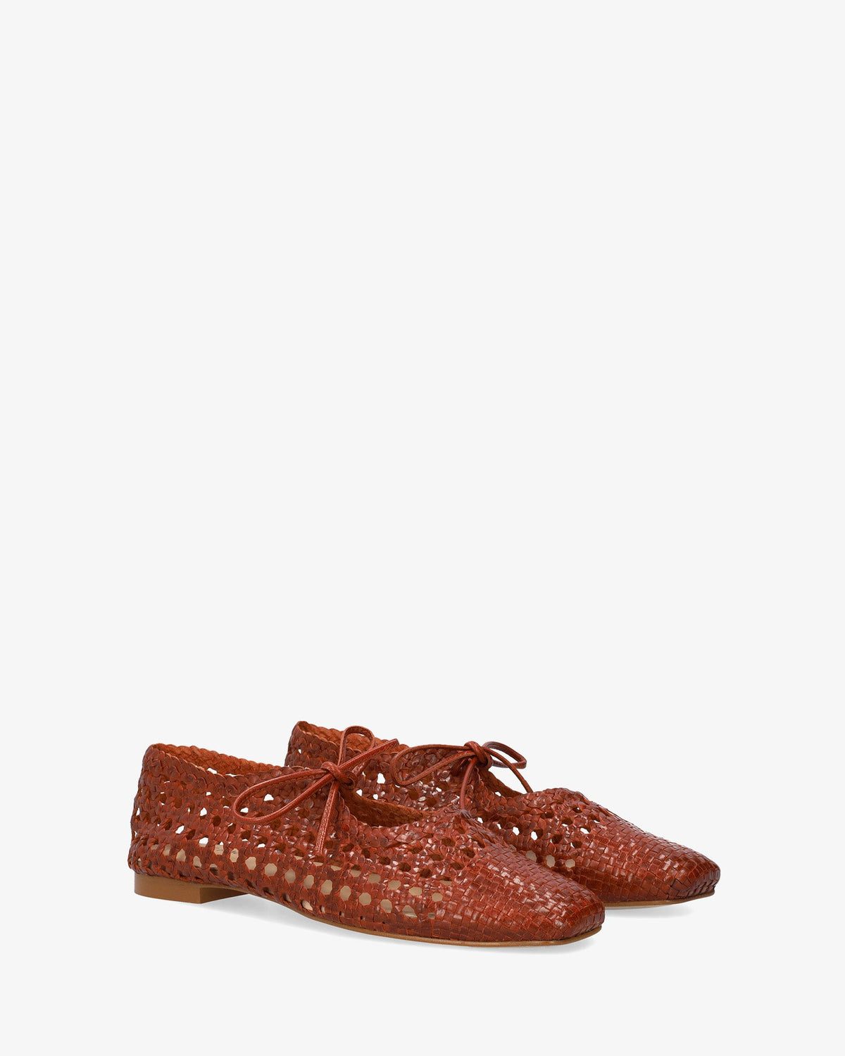 Flat shoes with a terracotta-colored mesh pattern
