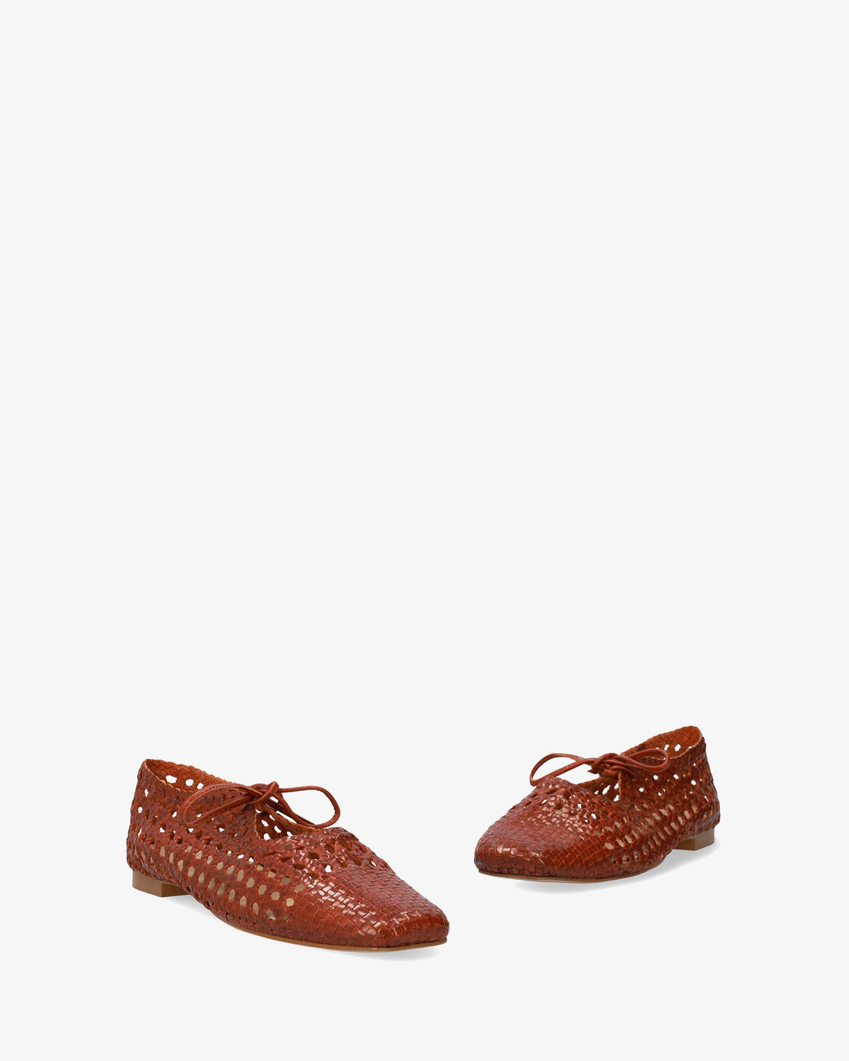 Flat shoes with a terracotta-colored mesh pattern