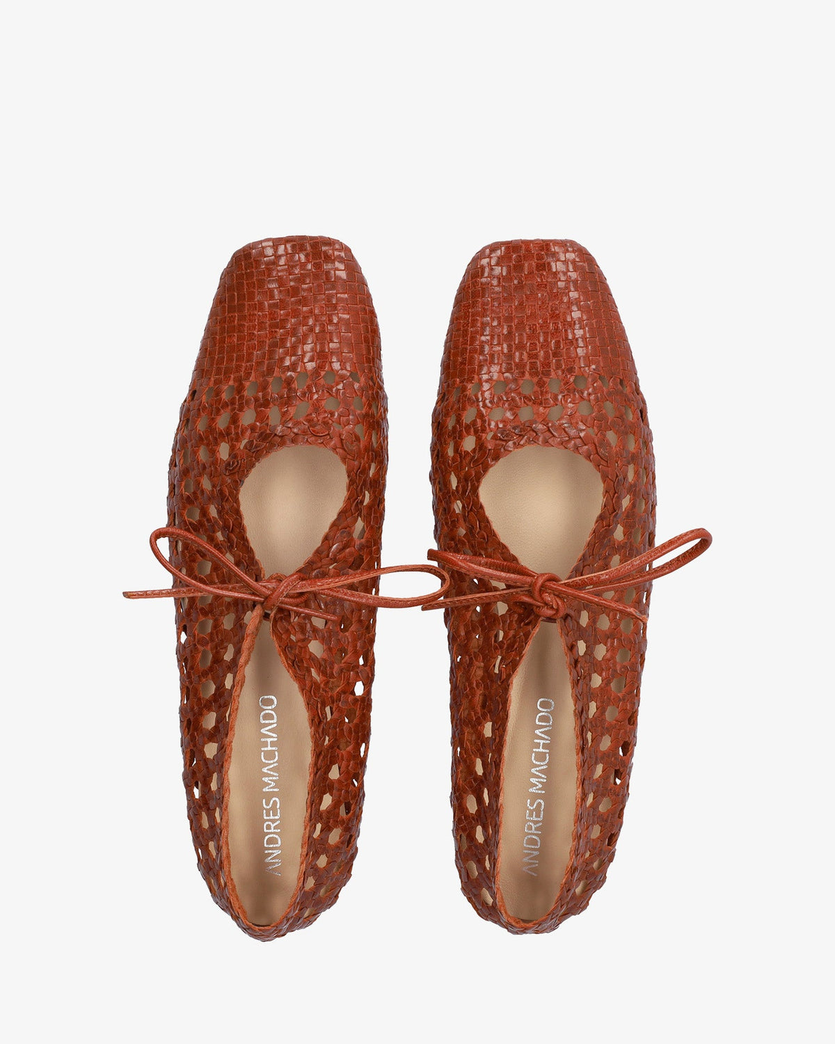 Flat shoes with a terracotta-colored mesh pattern